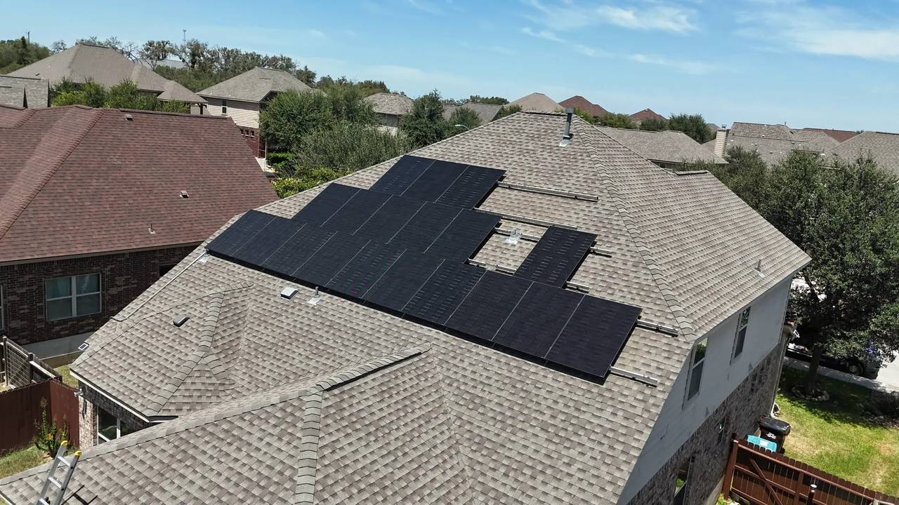 New all-black high-output solar panels on the same roof after the upgrade