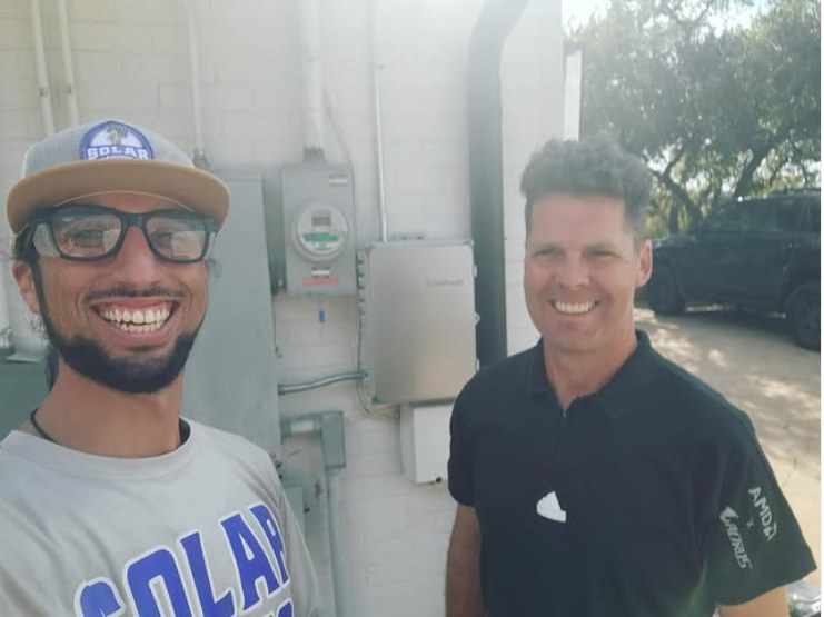 Dan with a Solar Service technician after his upgrade