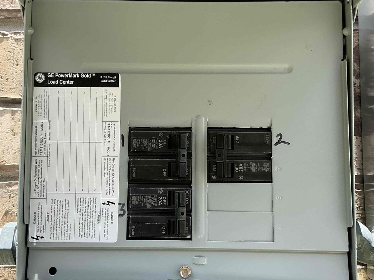 Open load center inspected for correct solar breaker sizing and labelling