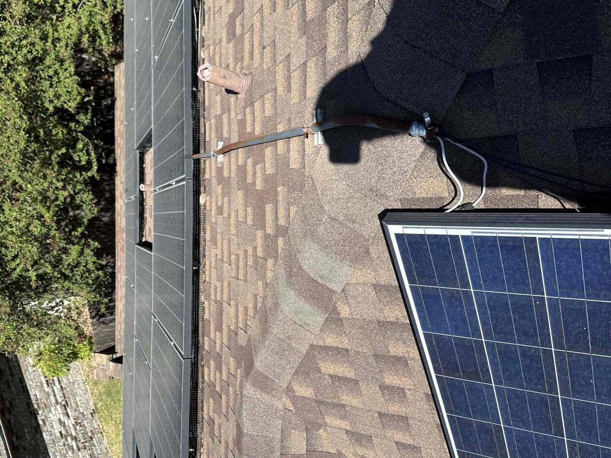Solar panel lifted from a Central Texas roof during a remove and reinstall