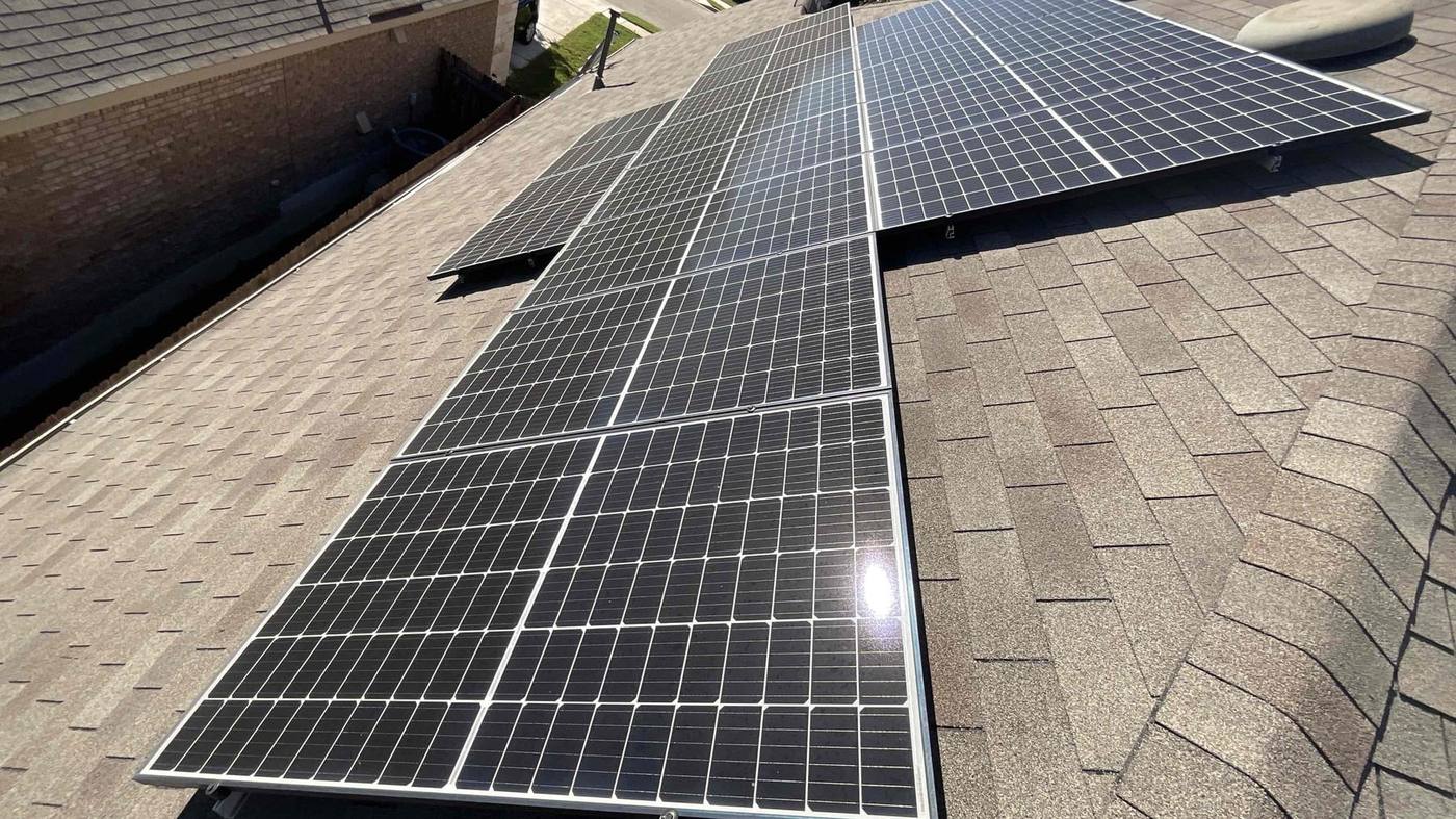 Rooftop solar array inspected during a system diagnostic in Central Texas